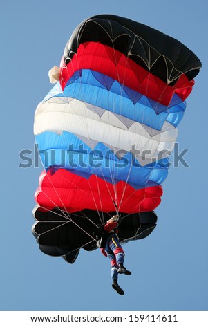 parachutist on blue sky extreme sport