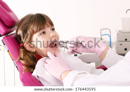 dentist extracted the tooth little girl with pliers