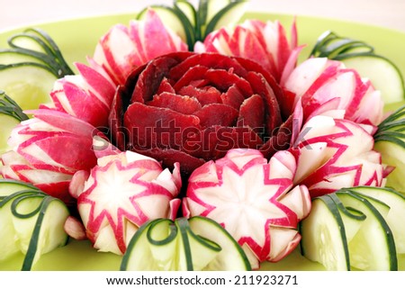 cucumber radish and beet decorated salad like flower closeup