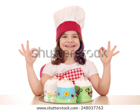 happy little girl cook with sweet cake and ok hand sign