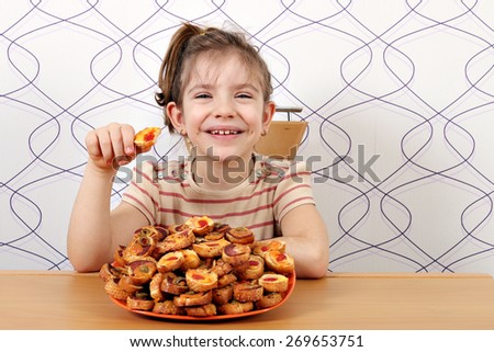 happy little girl eat bruschette