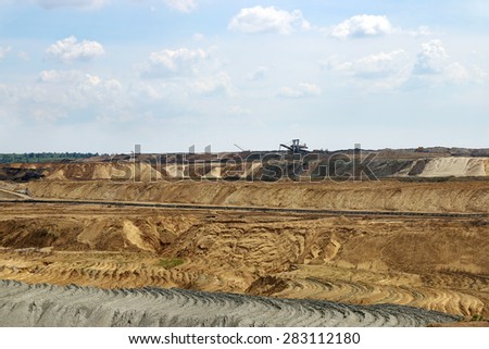 open pit coal mine with excavators landscape