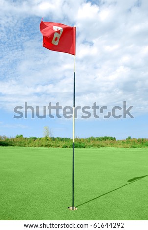 golf field with red flag