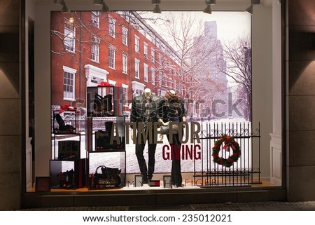 MUNICH, GERMANY - DECEMBER 25, 2009: Fashion store\'s shop window. Dressed man mannequins in a fashion store\'s shop window decorated for Christmas. Munich, Germany.
