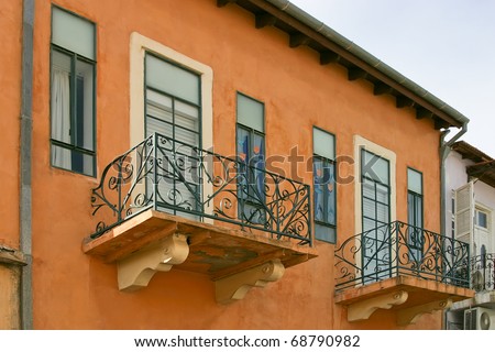 Vintage windows and balconies of old apartment building (Tel-Aviv. Israel).