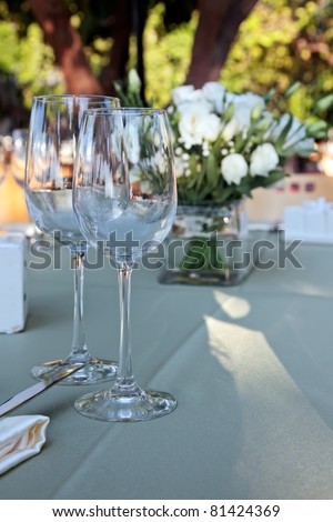 stock photo Wedding table setting with glasses of wine and white flowers