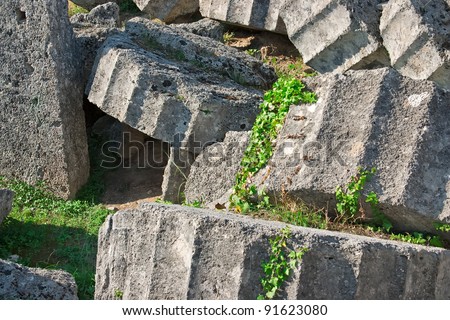 Ancient ruins of the Temple of Zeus at Olympia, Greece. Detailed view of broken column. Site of the ancient Olympic Games is situated on the Peloponnese. UNESCO world heritage site.
