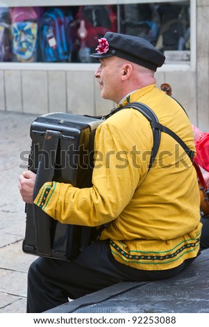 JERUSALEM, ISRAEL - MARCH 15: Purim carnival, unidentified street musician. March 15, 2006 in Jerusalem, Israel. Purim is celebrated annually according to the Hebrew calendar