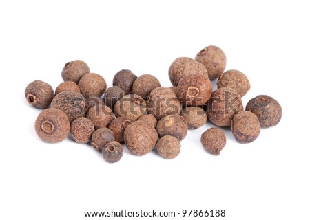 Pile Allspice (jamaica pepper) isolated on white background. Used as a spice in cuisines all over the world. The plant is also used in medicine.