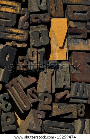 collection of wood type blocks with an emphasis on an exclamation point