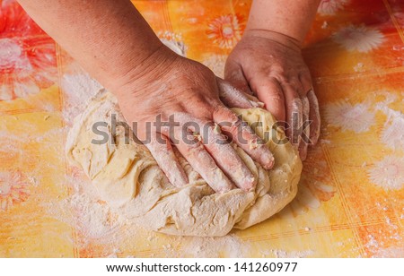 making bread, female hands, kneading a dough