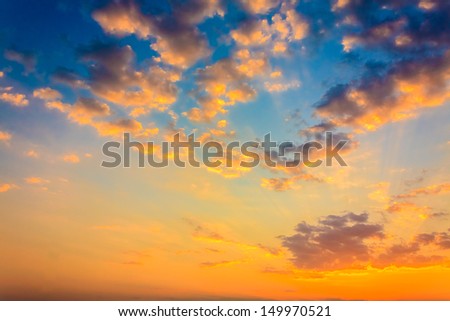 Bright orange and yellow colors sunset sky / Yellow blue sunrise sky with sunlight