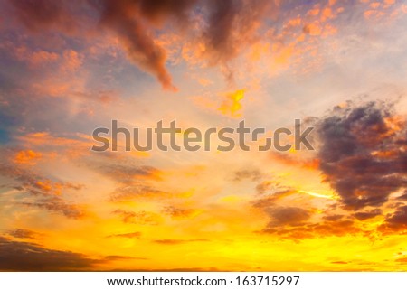 Bright Blue, Orange And Yellow Colors Sunset Sky. Sunlight through clouds