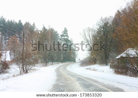 Snowy Land Road At Winter. Adverse Weather Conditions