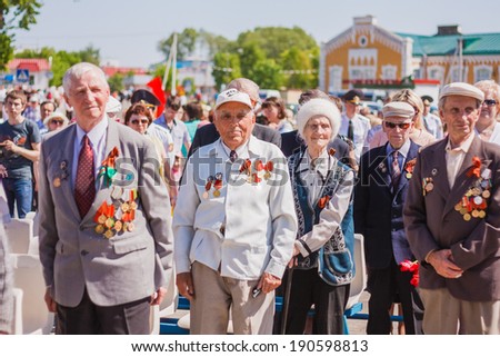 Gomel, BELARUS - MAY 9: Unidentified veterans standing listen to the Belarus hymn during the celebration of Victory Day on May 9, 2013 in Gomel, Belarus.