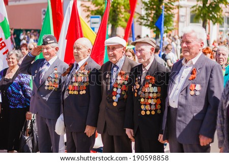 Gomel, BELARUS - MAY 9: Unidentified veterans standing listen to the Belarus hymn during the celebration of Victory Day on May 9, 2013 in Gomel, Belarus.