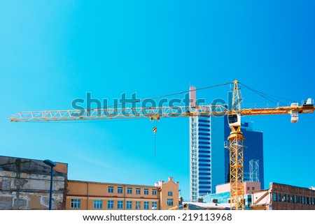 Construction Crane On Background Of New Modern Skyscraper And Old Buildings Intended For Demolition In Estonian Capital Tallinn, Estonia.