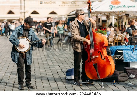 PRAGUE, CZECH REPUBLIC - OCTOBER 8, 2014: Street Busker performing jazz songs at the Old Town Square in Prague. Busking is legal form of earning money on Prague Streets.