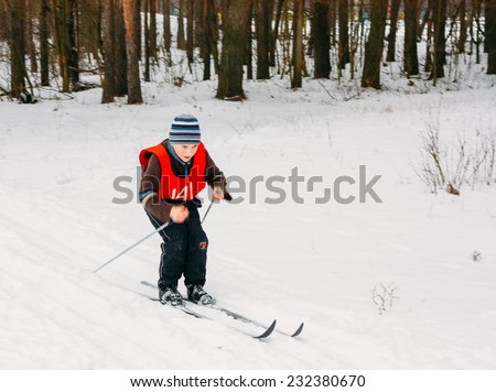 GOMEL, BELARUS - JANUARY 1, 2011: Unrecognizable Belarusian secondary school pupil preparing for school winter ski competitions \