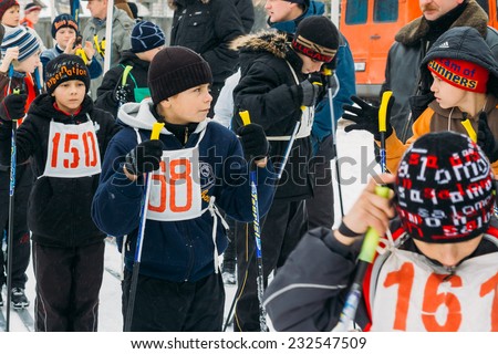 GOMEL, BELARUS - JANUARY 1, 2011: Unrecognizable Belarusian secondary school pupils preparing for school winter ski competitions \