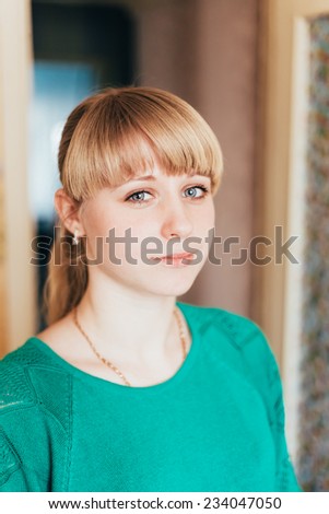 Beautiful Girl Young Woman In Green Jacket At Home. Close Up Portrait. Casual Style