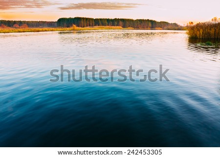 Calm Water Of Lake, River, Forest On Other Side. Landscape. Russian Nature Background.