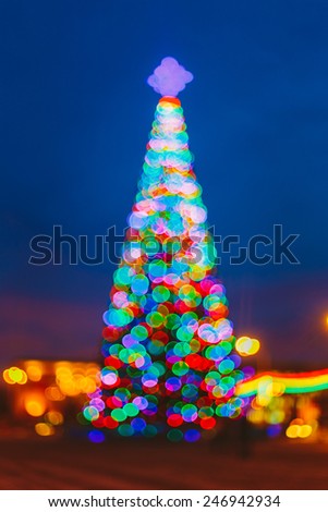 Defocused Blue Bokeh Background Effect. Design Backdrop. New Year Boke Lights Xmas Christmas Tree And Festive Illumination