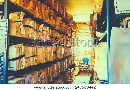 Closeup At Paper Waste Background. Keeping Records In Shelves