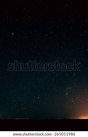 Natural Real Night Starry Sky Stars Background Texture. Yellow And Orange Colors Of Sunset