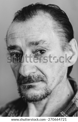 Portrait Of Serious Sad Old Adult Expressive Man With Beard Looking At Camera. Black And White, Monochrome Photo