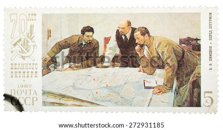 USSR - CIRCA 1987: Stamp printed in Russia shows Lenin planning strategy with two generals. 70th anniversary of the Russian revolution, circa 1987.