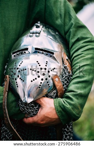 Iron Helmet Of The Medieval Knight. Helmet Of A Medieval Suit Of Armour In Hands