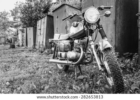 Old Motor Cycle Parked On Grass Yard. Vintage Generic Motorcycle Motorbike In Countryside