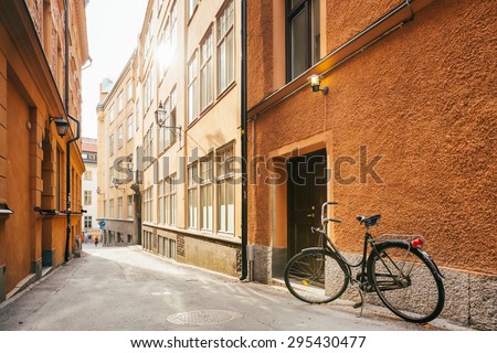 Parked Bicycle On Sidewalk In Old European Town. Bike Parking On Street, Stockholm, Sweden
