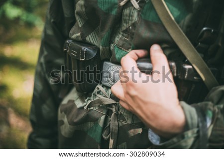 Unidentified re-enactor dressed as German soldier. German military decoration on the uniform of a German soldier.