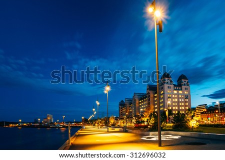 Night view of the city\'s waterfront, illuminated lanterns in the Oslo city center, Norway