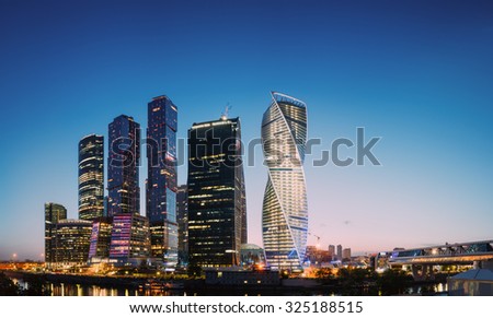 Panorama of Buildings Of Moscow City Complex Of Skyscrapers At Evening  in night illumination, Moscow, Russia. Business Center Of Modern Moscow