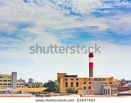 Factory pipe on a background of the blue sky.