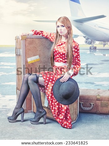 The beautiful young woman, waiting on the luggage in an airport.