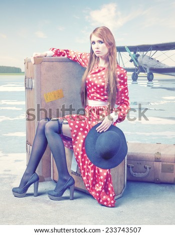 The beautiful young woman, waiting on the luggage in a retro airport.