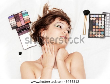 girl face with makeup items over the white background