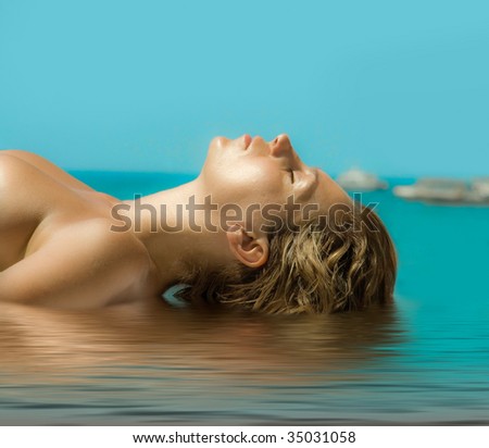 stock photo beauty girl tanning on the beach background photo