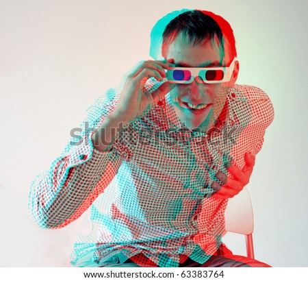stock photo young man looking through stereo glasses anaglyph effect 