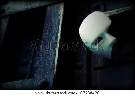 Masquerade - Phantom of the Opera Mask on Rusty Bridge Column