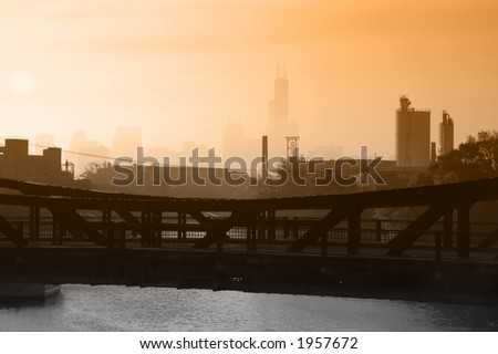 Industrial Chicago foggy skyline with steel draw bridge in foreground