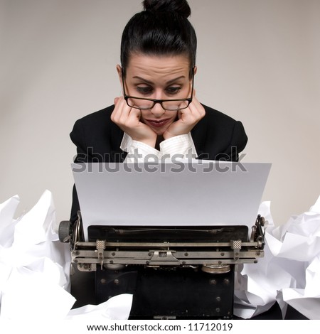 Retro business woman with vintage typewriter