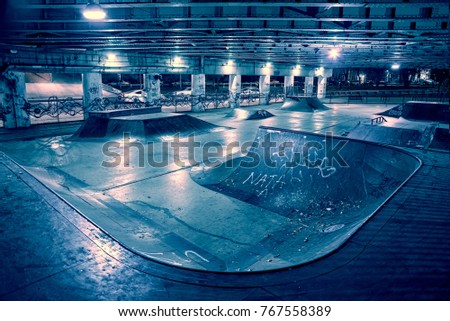 Gritty and scary city skate park at night in urban Chicago.