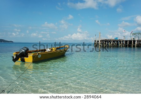 boat on clean crystal clear sea water