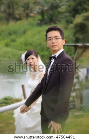 Asian Chinese wedding couple portrait blur background