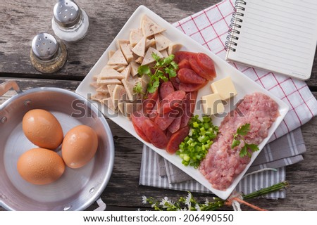 Ingredients for making Vietnamese style pan egg. with notebook
